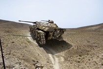 A rendering of a futuristic tank in a desert environment