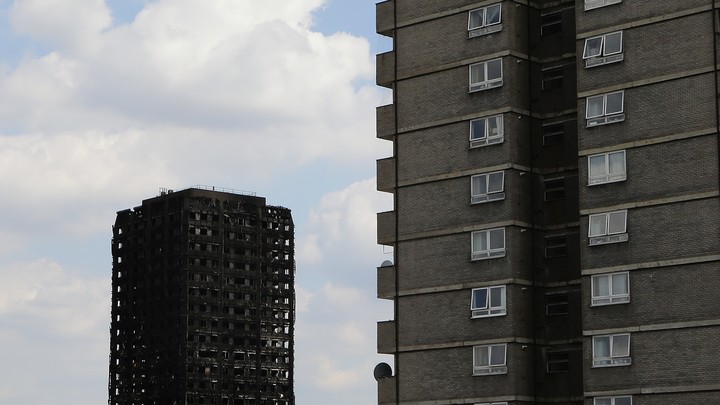 The burnt remains of Grenfell Tower pictured next to another high rise in west London on June 17, 2017.