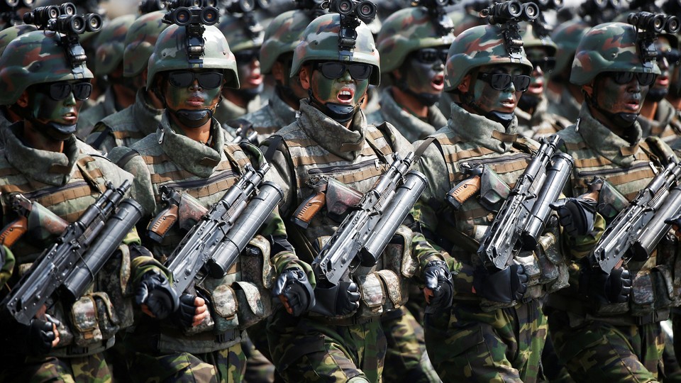 North Korean special forces soldiers march and shout slogans during a military parade marking the 105th birth anniversary of country's founding father, Kim Il Sung in Pyongyang, North Korea, on April 15, 2017.