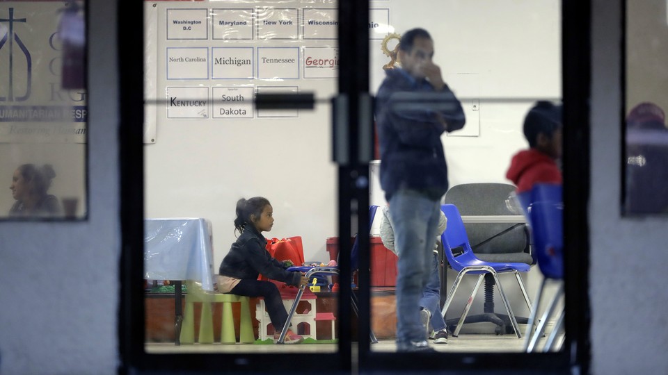 Immigrants wait in a humanitarian center in Texas.