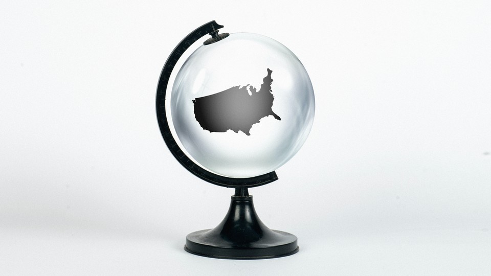 A transparent globe with an outline of the US contained inside it