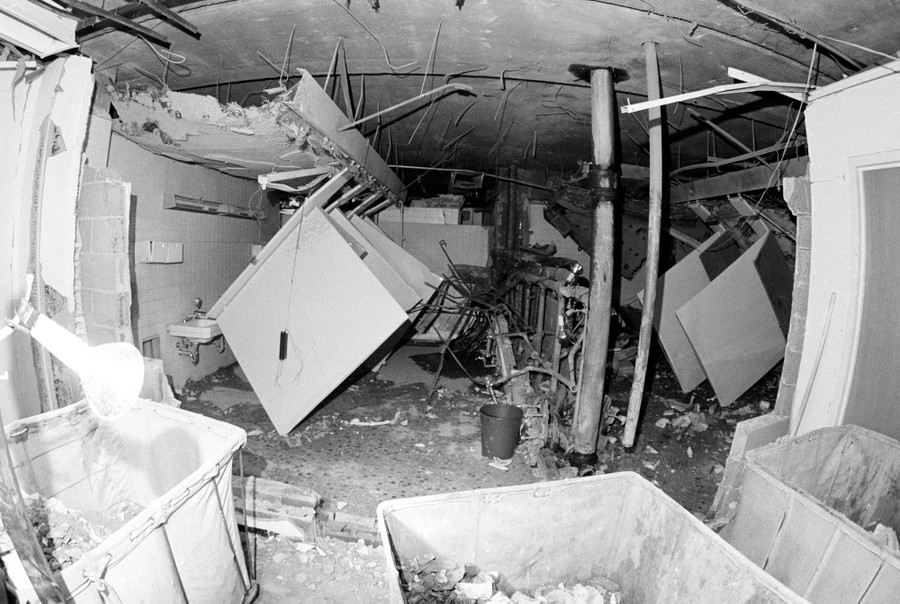 A heavily bomb-damaged office restroom