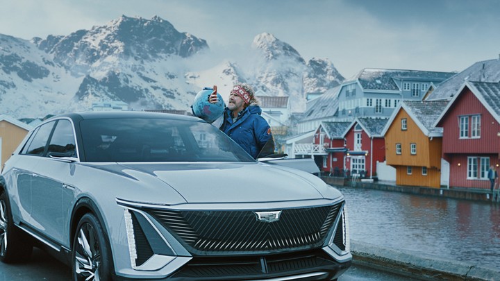 Will Ferrell holds his phone aloft standing in a Scandinavian scene.
