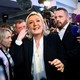 Far-right leader Marine Le Pen surrounded by people