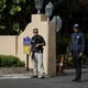 Two Secret Service agents stand at the Mar-a-Lago gates.