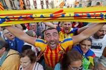 People in Barcelona react positively to the Catalan parliament's declaration of independence from Spain.