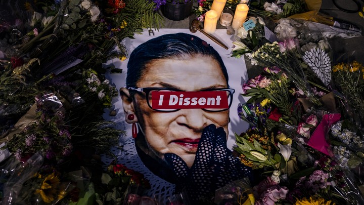 Ruth Bader Ginsburg portrait surrounded by flowers