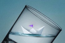 a level boat inside a sharply tilted glass