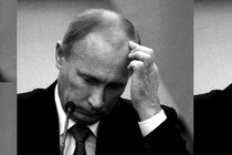 Vladimir Putin scratches his head.