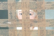 photo detail of antique painting of a face with blue eyes, obscured by a grid of packing tape stuck directly to painting
