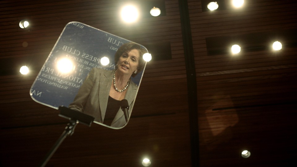 Nancy Pelosi reflected in a teleprompter in 2007