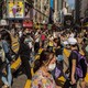 People wear masks at a crowded intersection in Hong Kong.