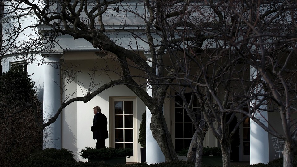 President Trump walks outside the White House.