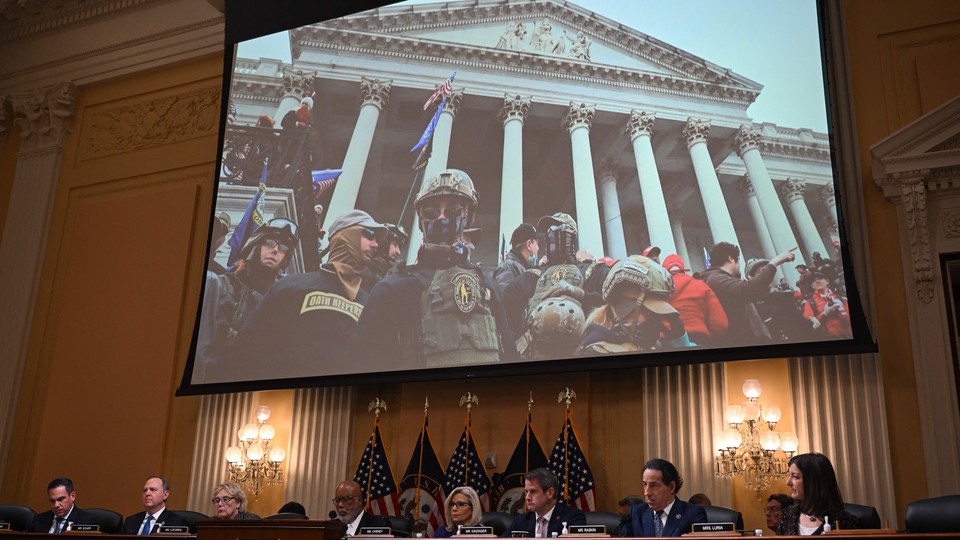 An image of rioters is projected during the final congressional hearing on the January 6th attack, on December 19, 2022.
