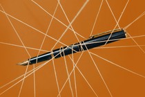 A pen being pulled by wires