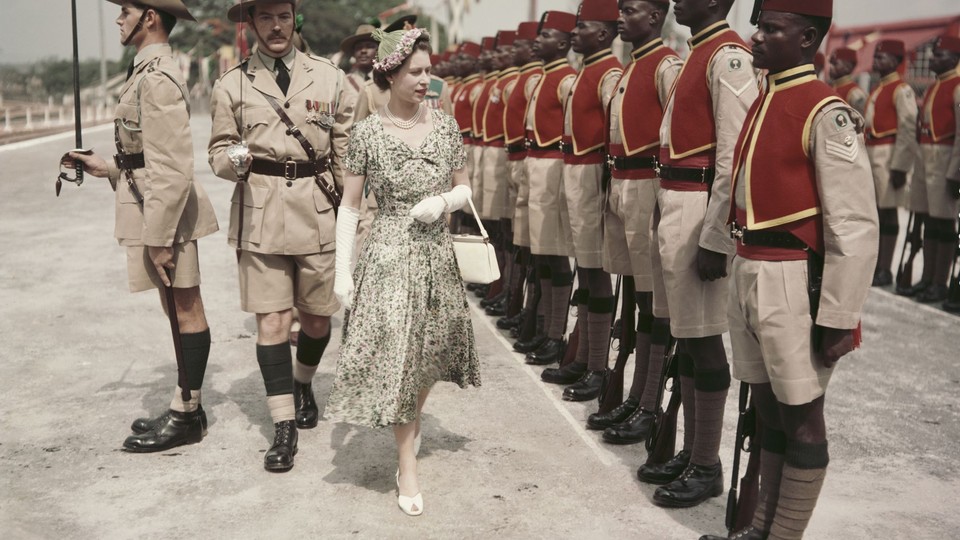 Queen Elizabeth II in 1956 inspecting a line of soldiers