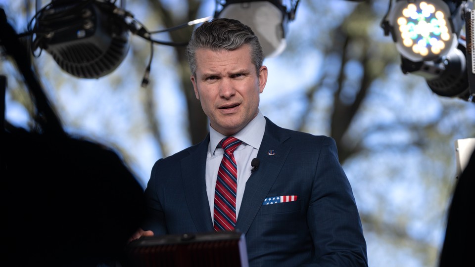 Photo of Pete Hegseth under stage lights