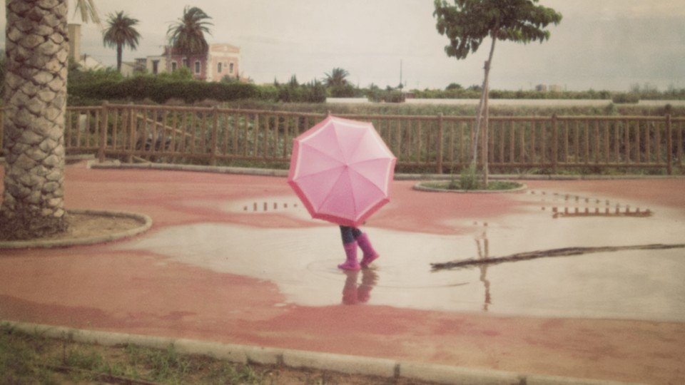 A person walking with an umbrella