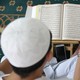 A Muslim man reads the Koran at Saigon central mosque in Vietnam.