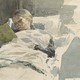 A painting of a young girl reading in bed