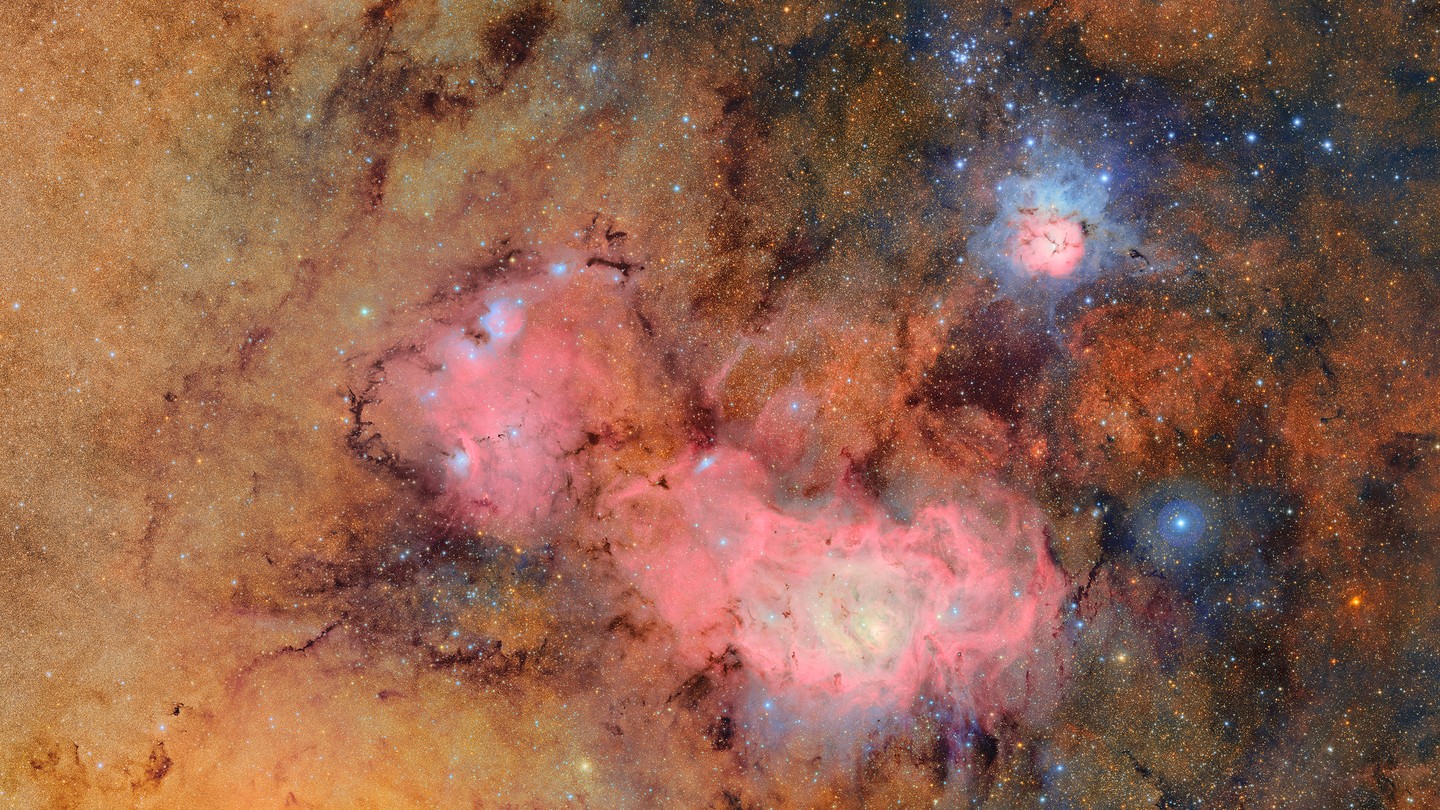 The Trifid nebula (top right) and the Lagoon nebula,