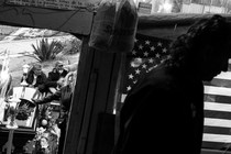 A black-and-white photo of immigrants in Tijuana, Mexico