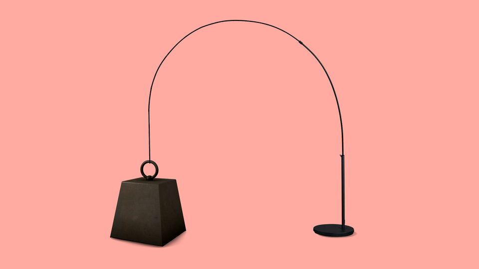 An image of a floor lamp that is drooping over.