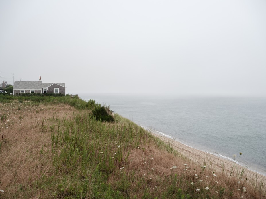 A cliff created by beach erosion in the Sconset section of Nantucket. The erosion s a problem being compounded by climate change. 2021.