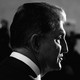 A black-and-white image of Senator Joe Manchin in profile