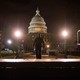 A police officer walks through the grounds of the U.S. Capitol on the night of January 6, hours after the insurrection.