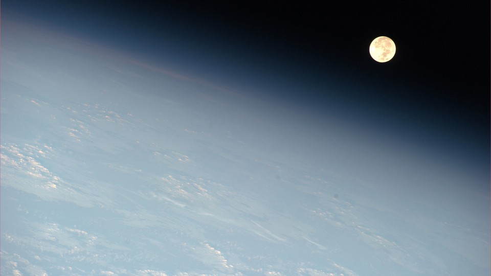 The moon seen through Earth's outer atmosphere