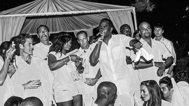 P. Diddy at the White Party surrounded by celebrities