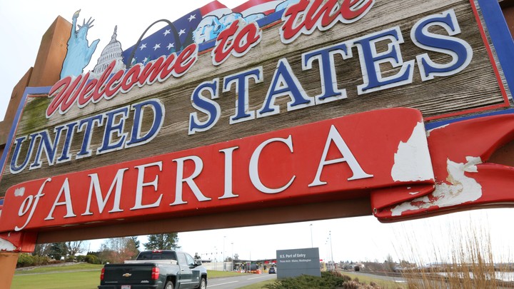 A sign stating, "Welcome to the United States of America"