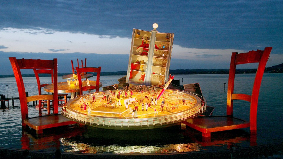 Singers perform on a stage designed like a Parisian bistro in Austria.