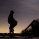 A person in silhouette against a starry sky