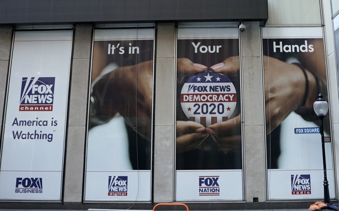 A political display is posted on the outside of the Fox News headquarters in New York in July 2020