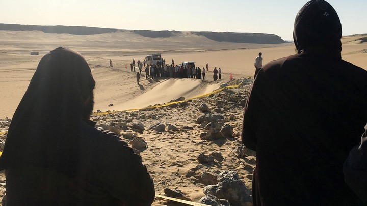 Monks survey the view following an attack on Coptic Christians traveling to a monastery in Minya, Egypt