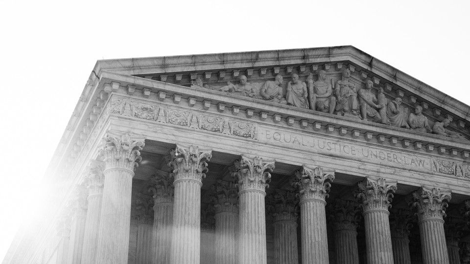 Black-and-white photograph of the Supreme Court building