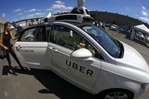 A journalist gets in a self driving Uber for a ride during a media preview at Uber's Advanced Technologies Center in Pittsburgh Monday, Sept. 12, 2016.