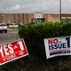 A photo showing "vote yes" and "vote no" signs outside an early-voting site in Ohio