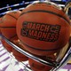 A rack of basketballs branded with the NCAA's March Madness logo