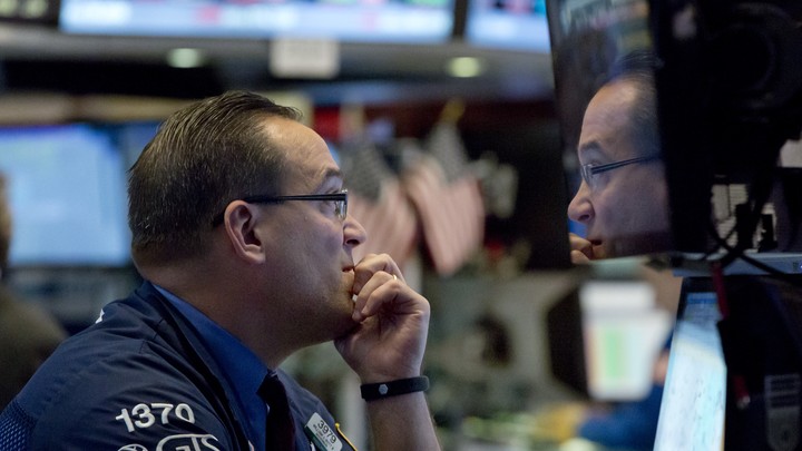 A trader at the New York Stock Exchange