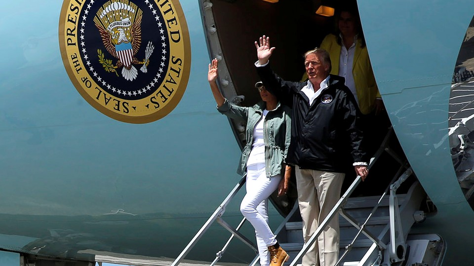 President Trump and First Lady Melania Trump arrive aboard Air Force One to survey hurricane damage, at Muniz Air National Guard Base in Carolina, Puerto Rico.