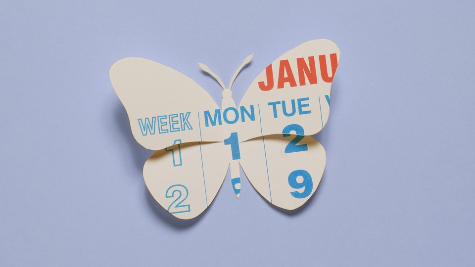 A paper cutout of a calendar in the shape of a butterfly