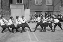 A group of students playing tug-of-war