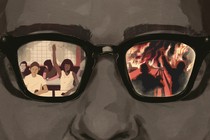 A custom image of a face with glasses; an image of a classroom is seen in one lens, and of soldiers at war in the other.  