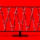 A computer screen tangled in barbed wire against a red background