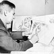 Theodor Seuss Geisel, American writer, poet, and cartoonist, at work on a drawing of a grinch.