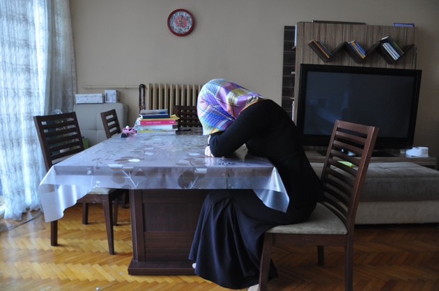 Asli, a Gulenist teacher who lost her job after the coup, seated at home (Lauren Bohn)