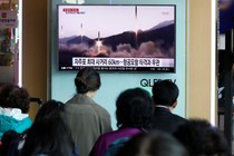 People at a railway station in Seoul, South Korea, watch a TV news report about North Korea's missile launch in April 2017.